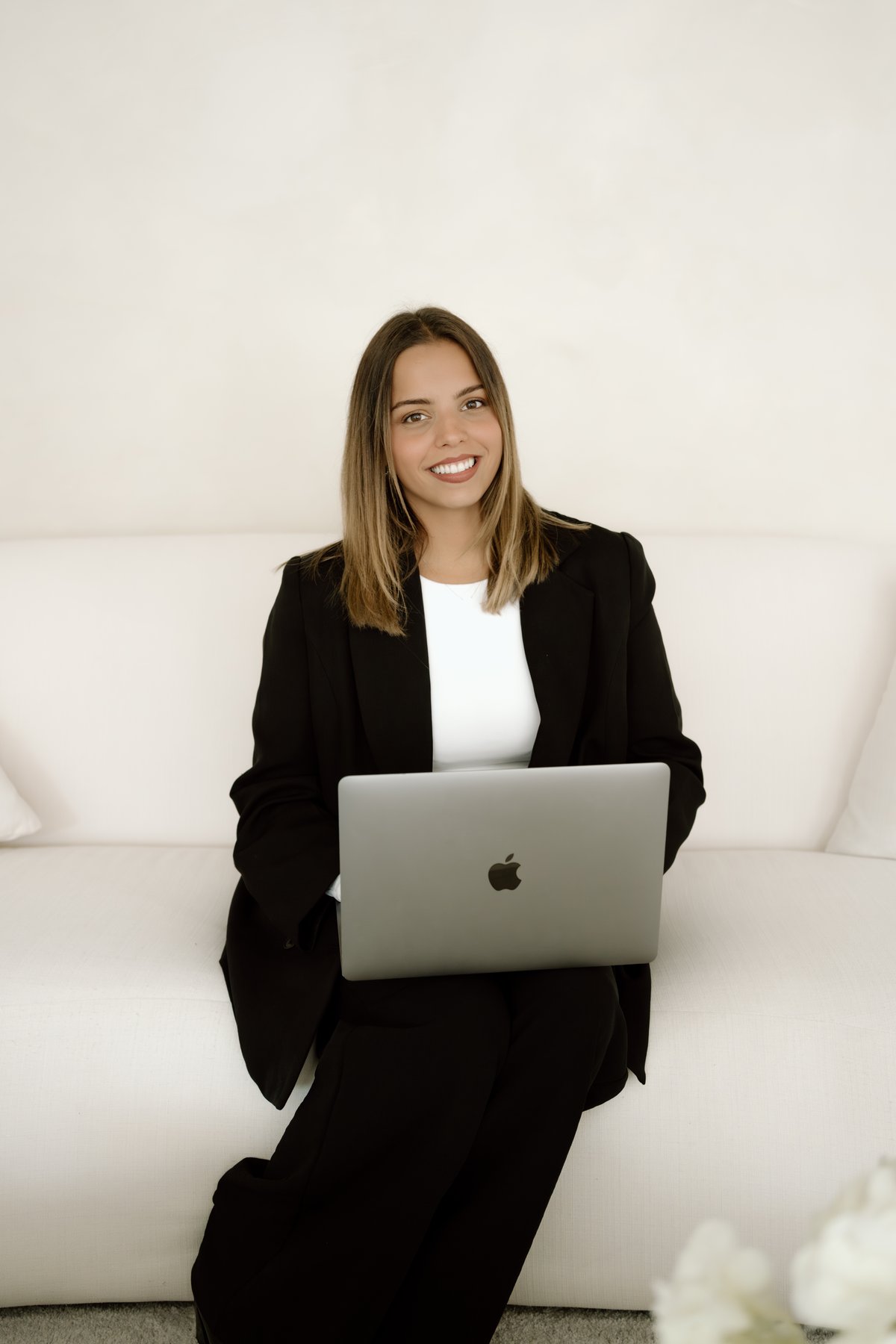 Caroline Aguiar, Operations Manager at The Knight Group, working at her laptop