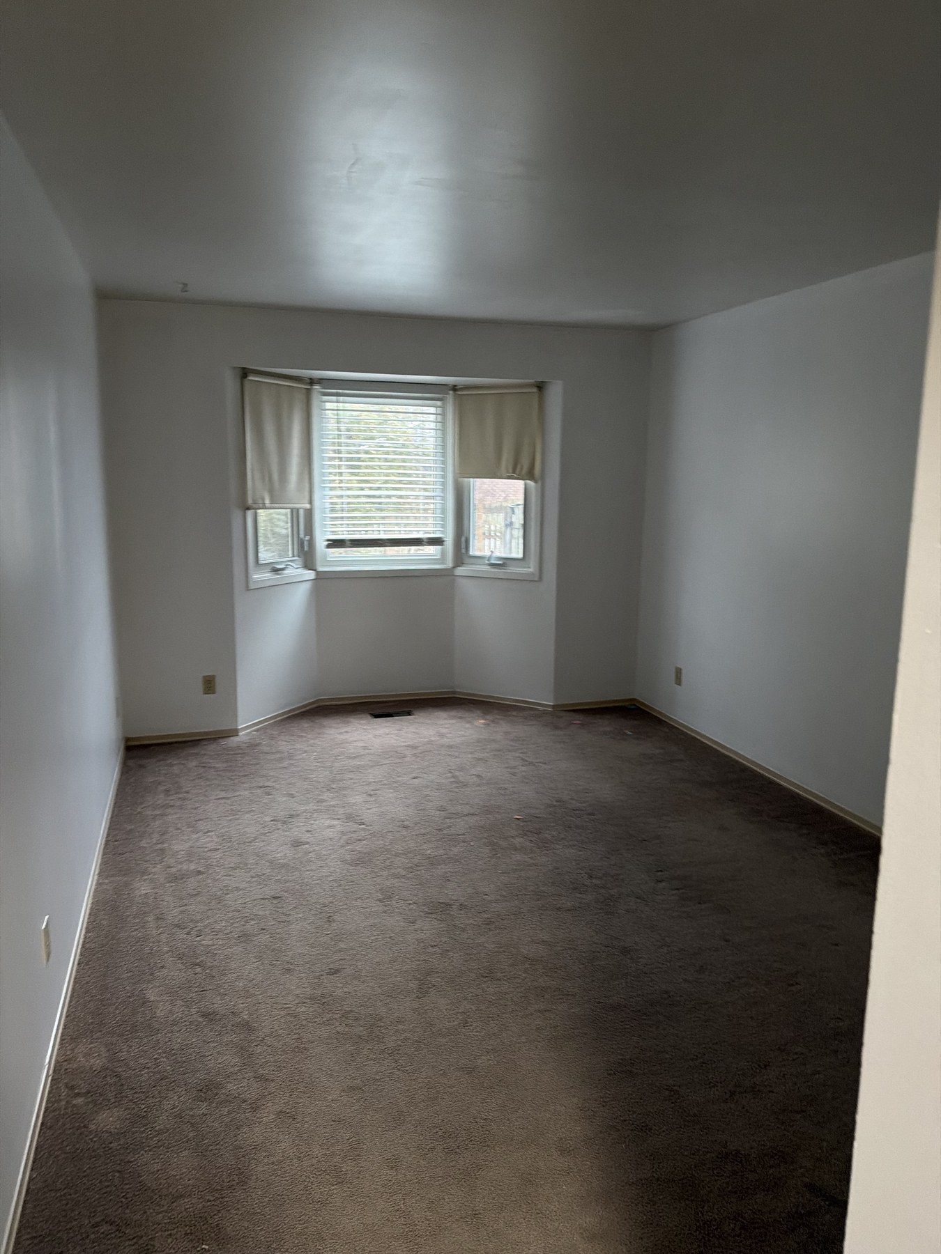 Before staging: the bedroom empty and unfurnished